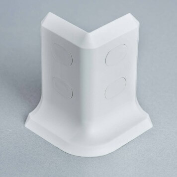 Angle externe gris-blanc pour plinthe PVC à lèvres souples avec bouchons insérés