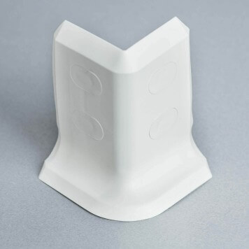 Angle externe blanc pour plinthe PVC à lèvres souples avec bouchons cache-vis